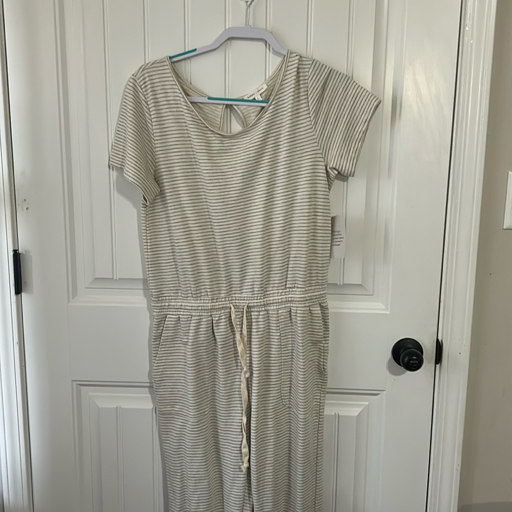 Jumpsuit grey and cream striped . With pockets and drawstring .size large